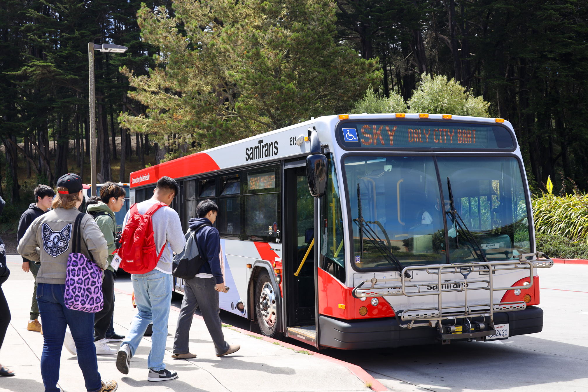 Group of students boarding bus