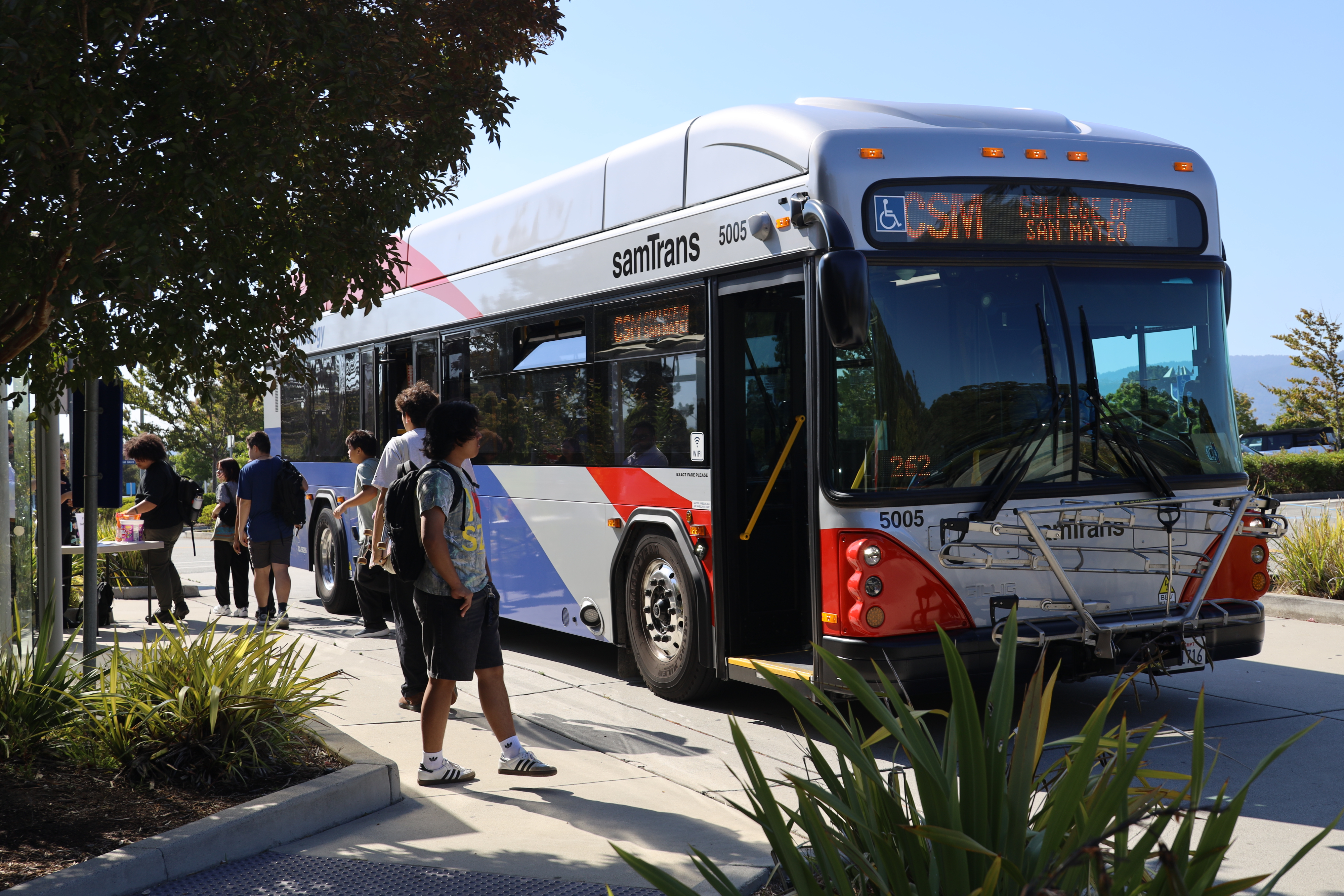 Group of students boarding bus