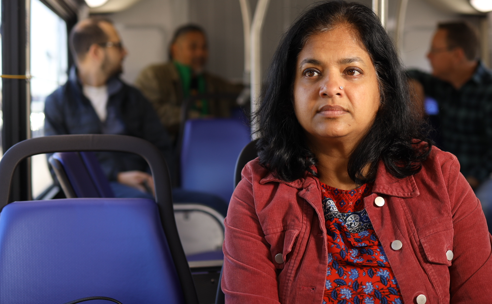 Passenger looks out of window on SamTrans bus