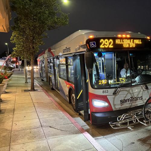 Route 292 at a bus stop on California Drive in Burlingame at night.