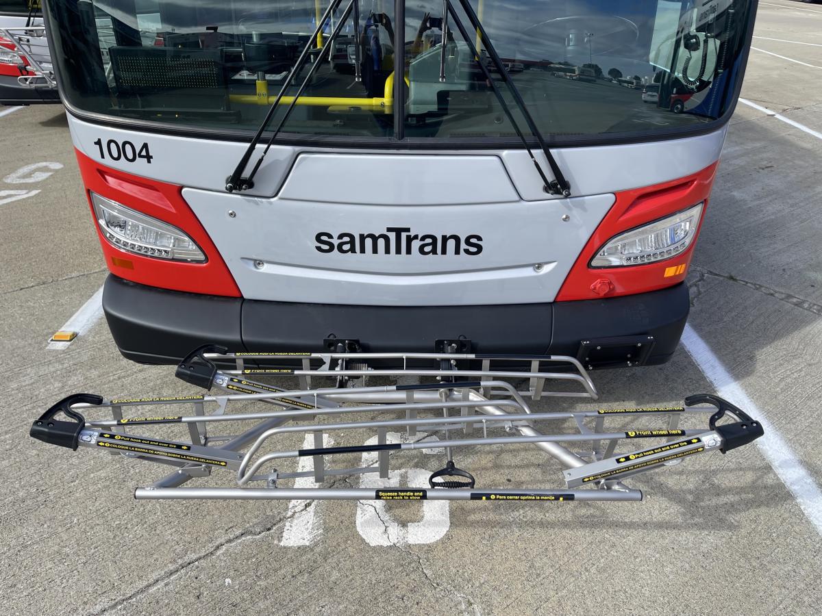 The front of a SamTrans bus with a new bike rack.