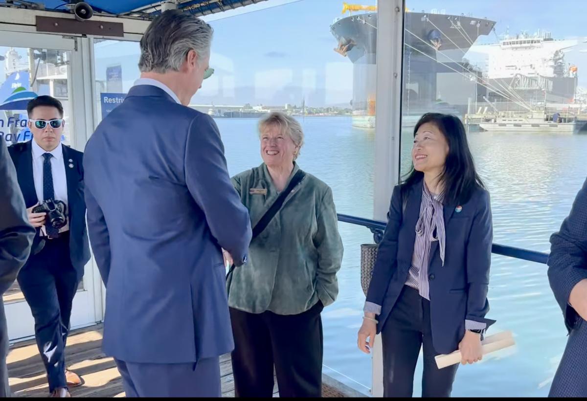 Gov. Newsom greets SamTrans Board Chair Marina Fraser and SamTrans General Manager/CEO April Chan in Oakland.